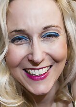 Blonde MILF Anesa Chance sniffs heels and plays with handcuffs.