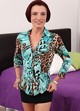 Small breasted older redhead Stella Banks plays with her pussy.