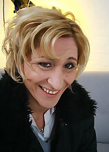 Older mature amateur Teresa Lynn stuffs huge dildo into her twat.
