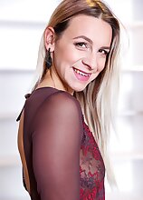 Super fit mature babe Bianca Ferrero spreads her pussy lips.