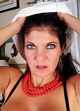 Busty housewife Coralyn Jewel pulls her panties down past her great ass.