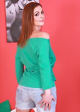 Redhead MILF Mischelle exposes her tasty hairy pussy.
