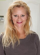 Older wife Ali Jones strips naked after work.