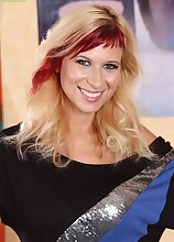 Spunky MILF Anastasia Devine licks her perky tits.