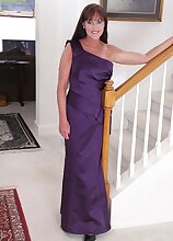 Horny older babe Cynthia Davis peels off purple dress.