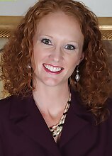 Small breasted curly redhead Ande exposes her older pussy.