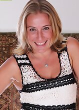 Mature blond babe Sky pulls panties down over tan lined ass.