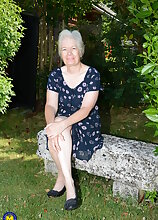 Horny British mature lady playing in the garden
