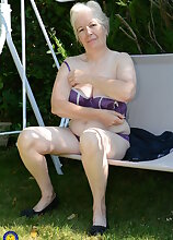 Horny British mature lady playing in the garden
