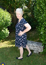 Horny British mature lady playing in the garden