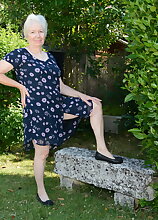 Horny British mature lady playing in the garden