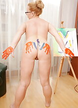 Naughty mature lady playing with paint