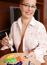 Naughty mature lady playing with paint