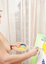 Naughty mature lady playing with paint