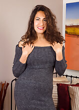 Sexy 33 year old brunette Isabelle looking elegant in her gray dress