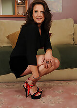 43 year old MILF Chane strips and then starts playing with her feet