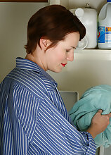 Redheaded housewife Vada showing off her shaven and mature pussy