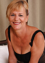 Blonde and 56 years old Lili strips off her panties to reveal natural bush