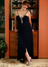 35 year old redheaded Julie slips out of her elegant dress and spreads