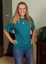 Hot blonde housewife Sara J strips and pinches her perky nipples