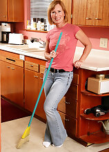 Sexy 42 year old Cheyanne bends over the kitchen counter in here