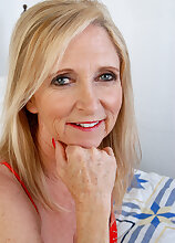 55 year old Annabelle stabs at her mature pussy with a big dildo