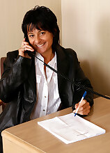 Horny MILF Cory can strip and play and still does her office chores