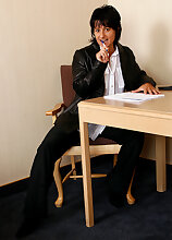 Horny MILF Cory can strip and play and still does her office chores