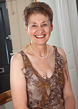 60 year old Dee shows off her shaven mature pussy in this one
