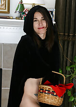 Furry bushed and mature Shelby playing little red riding hood