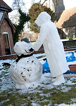 Pregnant and mature Jan warms up after playing outside in the snow