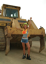 Petite MILF spreads her legs outside with the construction tractors