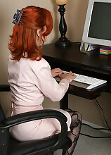 Redheaded office girl looks great naked at 53 years old