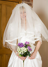 52 year old Hazel pulls off her wedding dress and spreads her ass