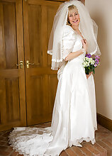 52 year old Hazel pulls off her wedding dress and spreads her ass