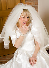 52 year old Hazel pulls off her wedding dress and spreads her ass