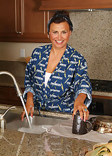 Busty 47 year old housewife spreads her legs in her kitchen