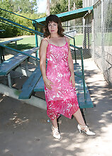41 year old Andie shows her mature bush while playing in the park