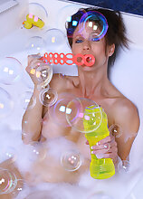 Horny brunette Madison gets herself off in a sudsy bathtub here