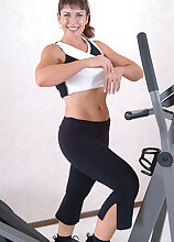Furry pussied Andie works out and then spreads legs