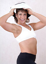 Furry pussied Andie works out and then spreads legs