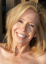 Smoking hot 54 year old in the garden for a tan
