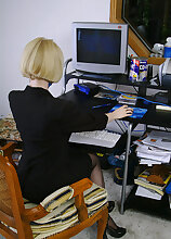 Blonde office MILF strips and spreads her ivory legs