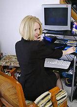 Blonde office MILF strips and spreads her ivory legs