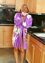 37 year old ebony chick gets naughty in the kitchen