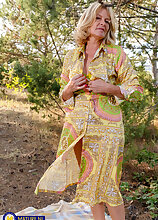 Diana is a hot blonde MILF that loves masturbating in the forest and get her shaved pussy wet