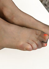 Footfetish MILF Andrea V. gets really turned on by playing with her feet