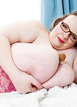 Huge XXL Lady is a BBW with huge saggy natural tits masturbating in bed