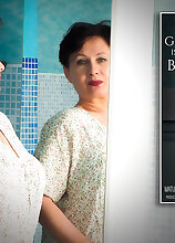 Modern Grandma Nata loves to play with her dildo and her pussy in the bathroom