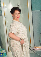 Modern Grandma Nata loves to play with her dildo and her pussy in the bathroom